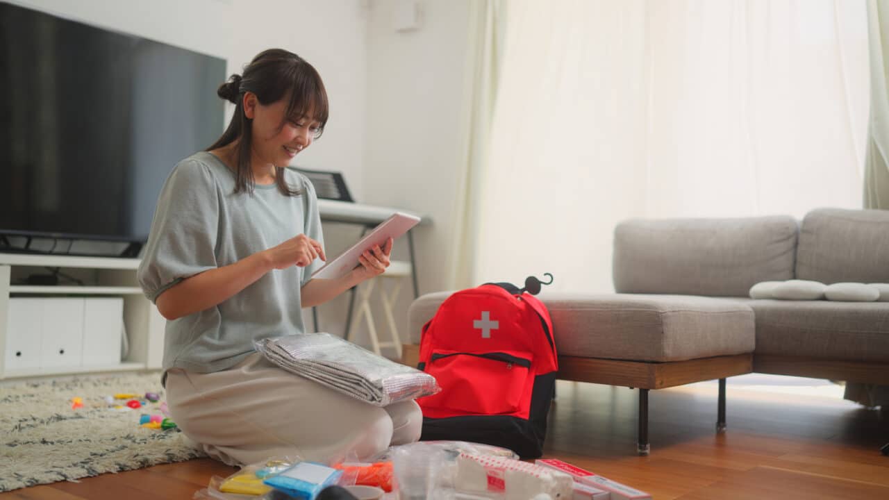 Woman prepares emergency bag