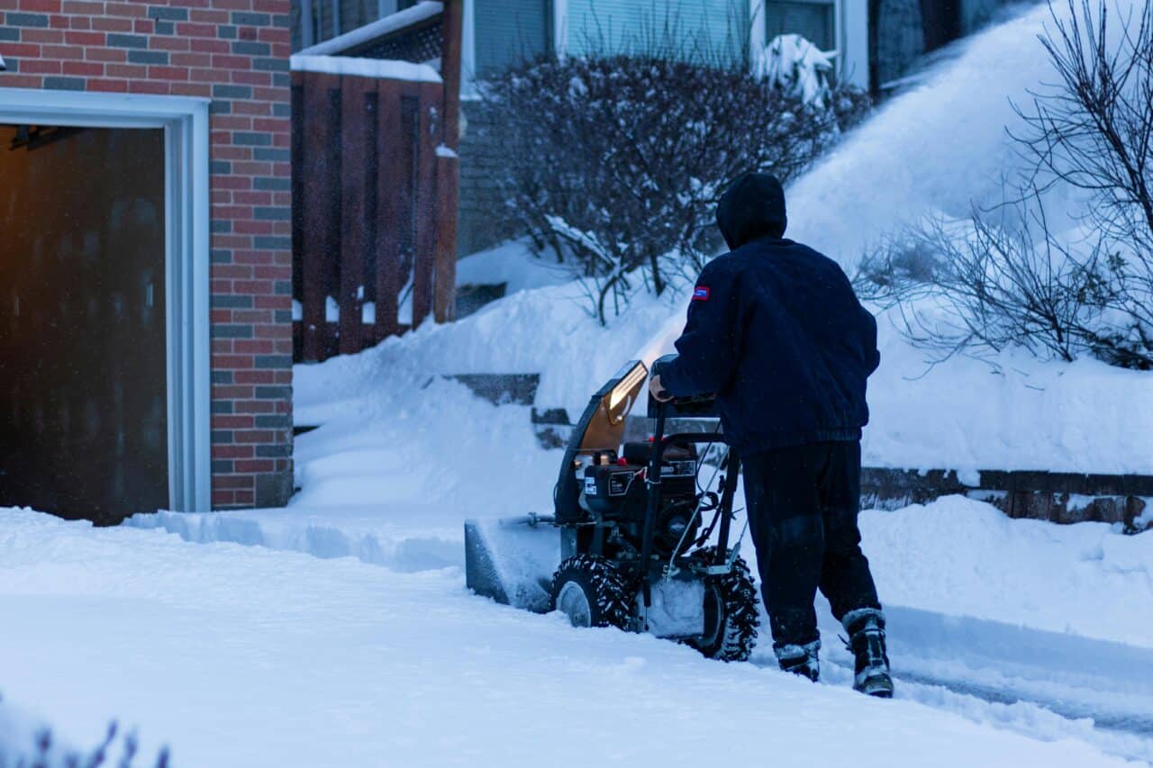 Person using a loud snowblower on their driveway.